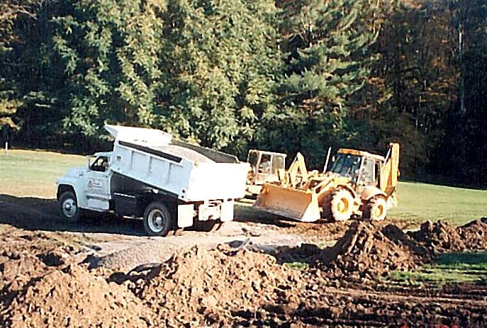 RM Landscape dump truck and loader working on a landscape construction project